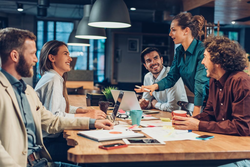 Smiling group of people collaborating in an office