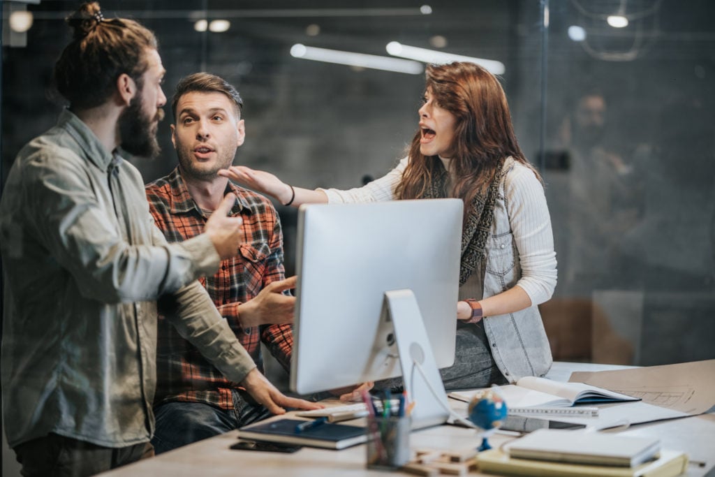 Employees arguing in the office Employees arguing in the office